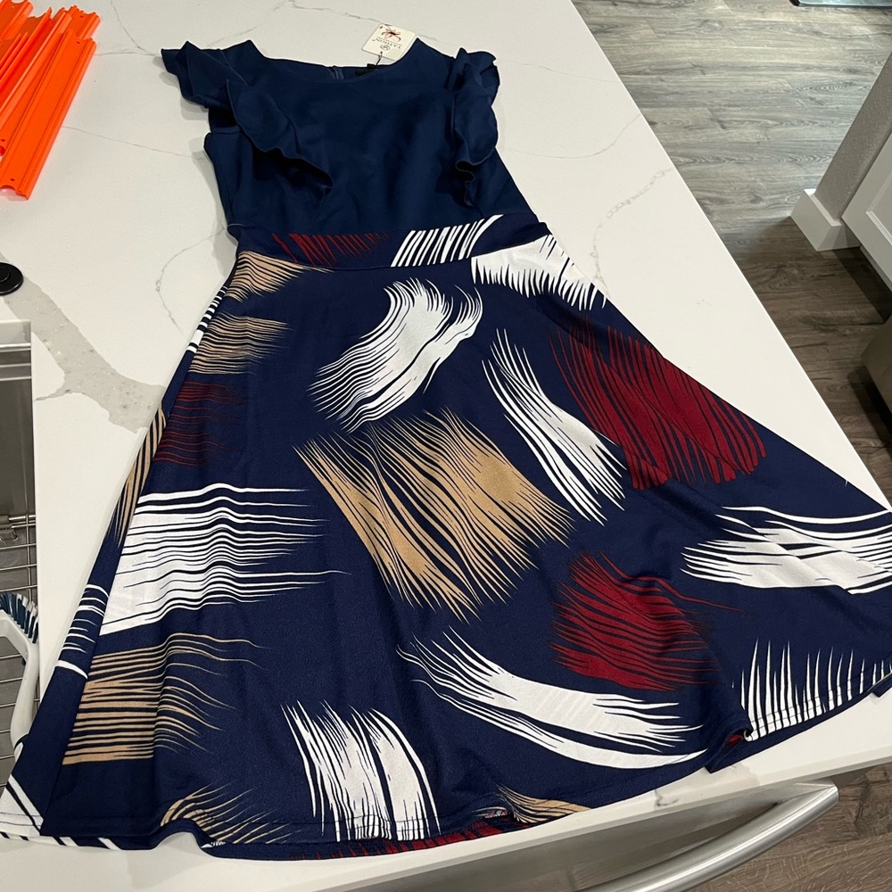 Women’s medium Blue Dress with flowy bottom and ruffled sleeves